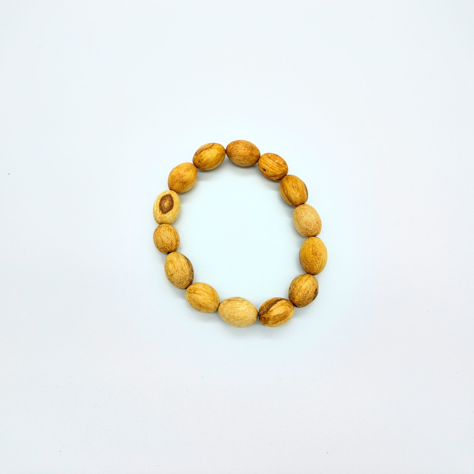 a beaded bracelet made of natural palo santo wood that is very fragrant and considered very high frequency in spirituality for cleansing and clearing and attracting good energy